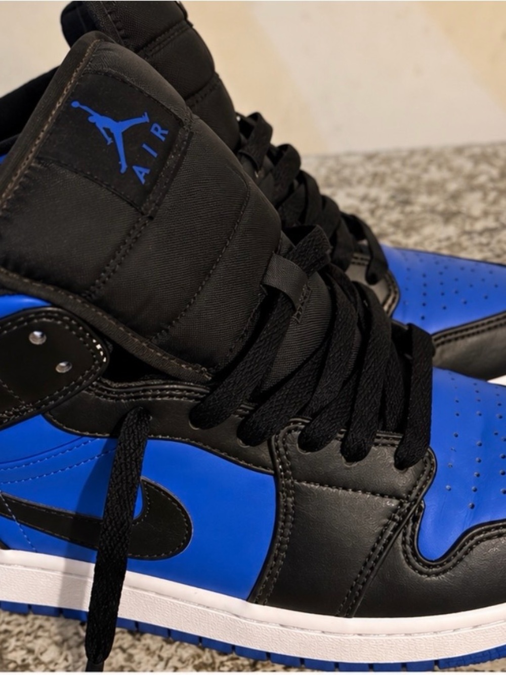 Jordan Men’s High-Top Sneakers in Black and Royal Blue